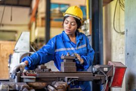 woman-worker-in-uniform-operating-machine-at-facto-2023-11-27-05-14-44-utc--1-