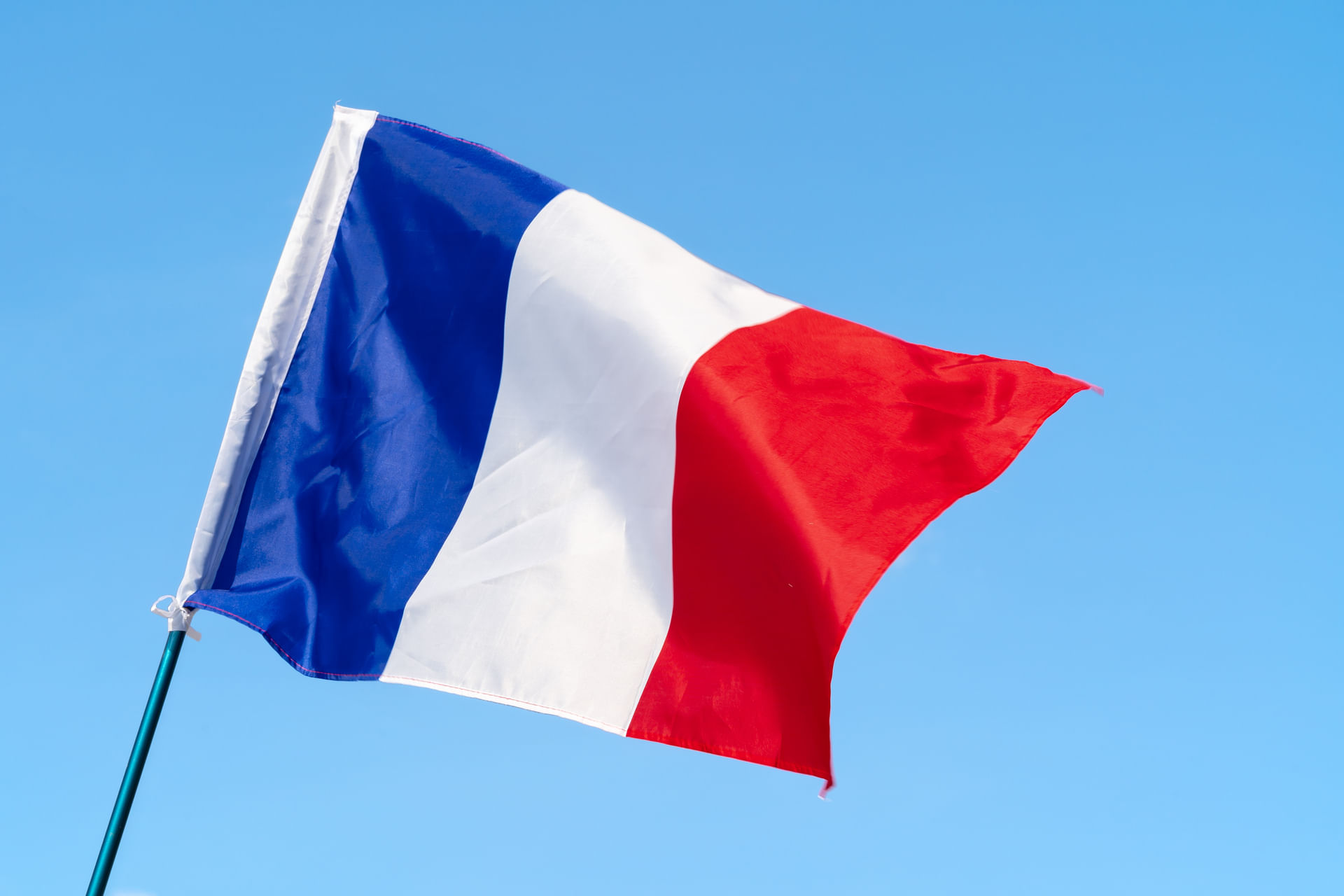 flag-of-france-waving-in-the-wind-in-the-sky-2023-11-27-04-49-54-utc--1-