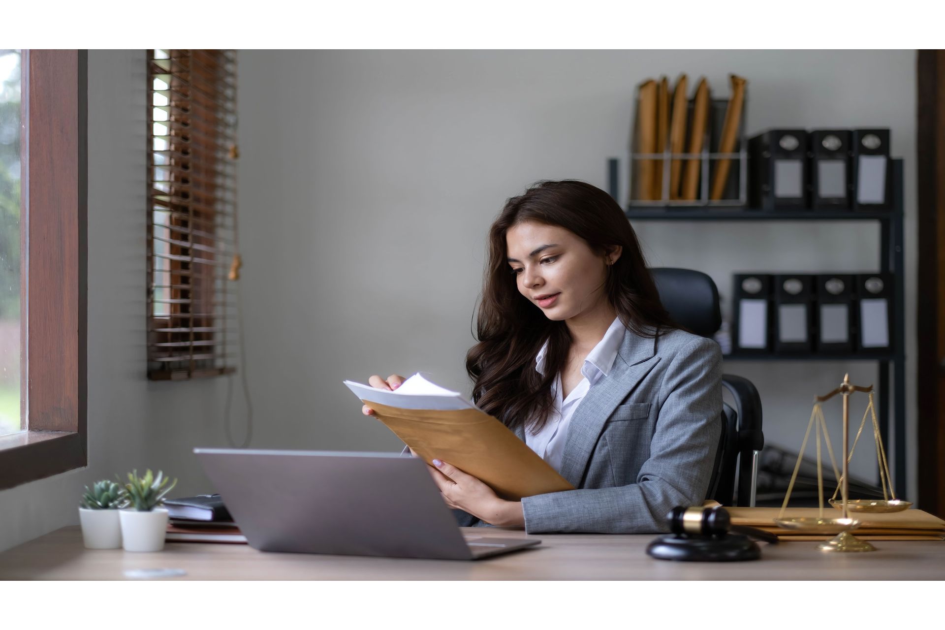 asian-lawyer-woman-working-with-a-laptop-computer-2023-11-27-05-26-09-utc--1-