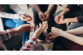 close-up-of-hands-of-people-sitting-in-a-circle-du-2023-11-27-05-26-25-utc--2---1-