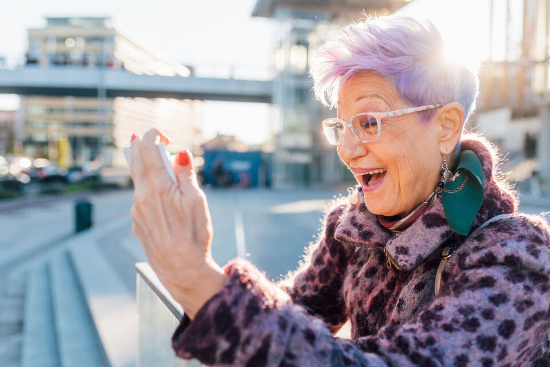 senior-woman-with-colorful-hair-taking-a-selfie-in-2024-07-05-19-25-41-utc--1-