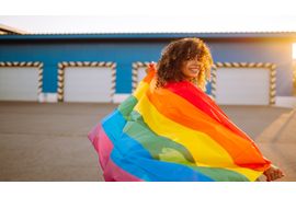 american-lesbian-woman-holding-lgbt-rainbow-flag-2023-11-27-05-23-03-utc--1-