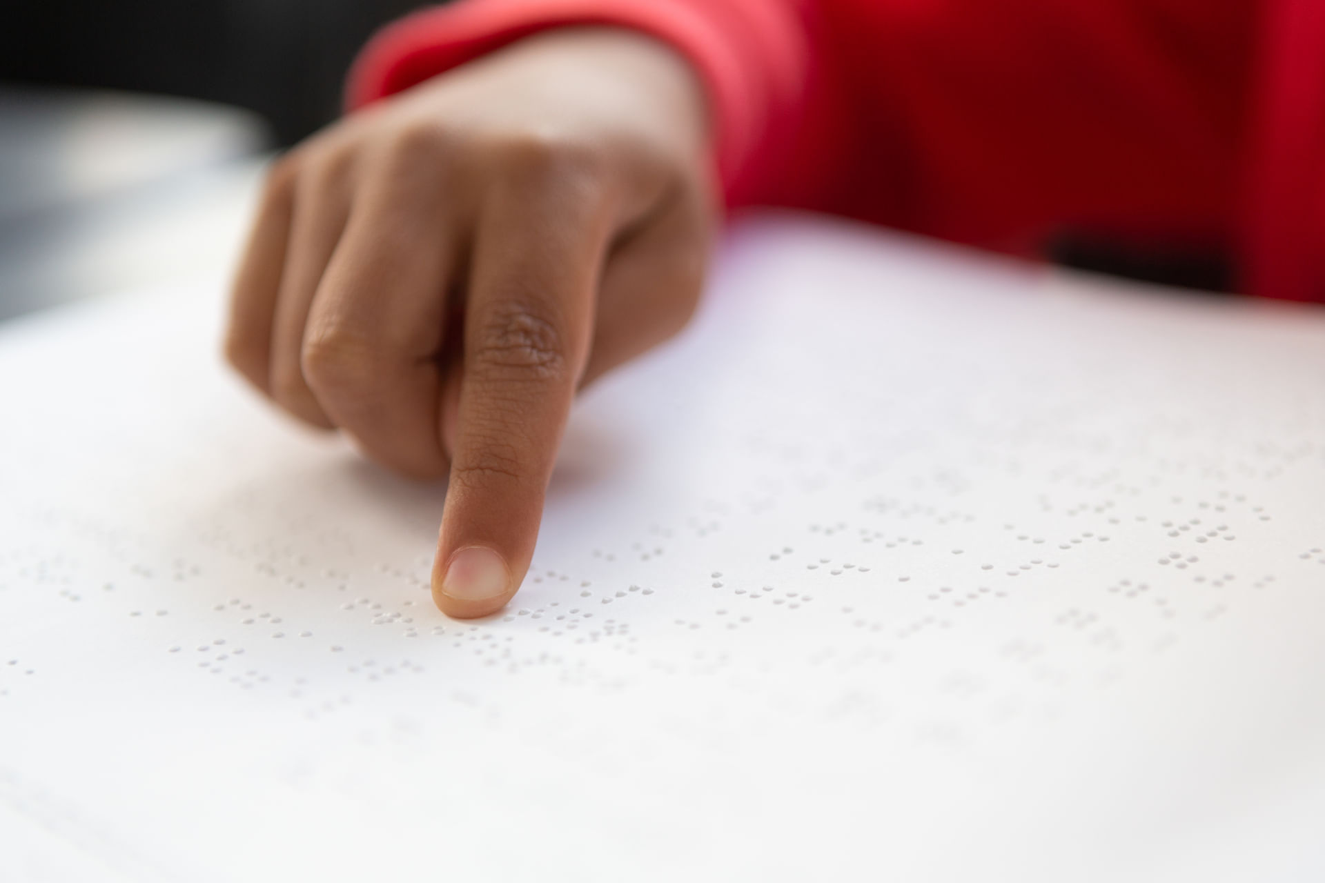 close-up-of-blind-mixed-race-schoolboy-hand-readin-2023-11-27-05-14-48-utc--1-