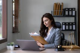 asian-lawyer-woman-working-with-a-laptop-computer-2023-11-27-05-26-09-utc--1-