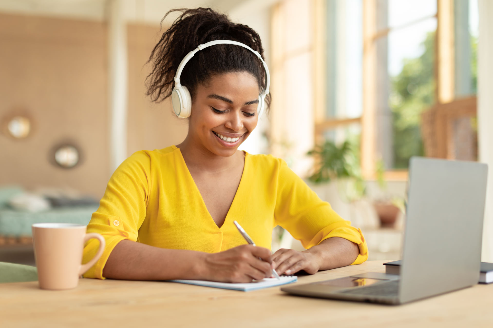 happy-african-american-lady-studying-remotely-from-2023-11-27-05-27-27-utc--1---1-