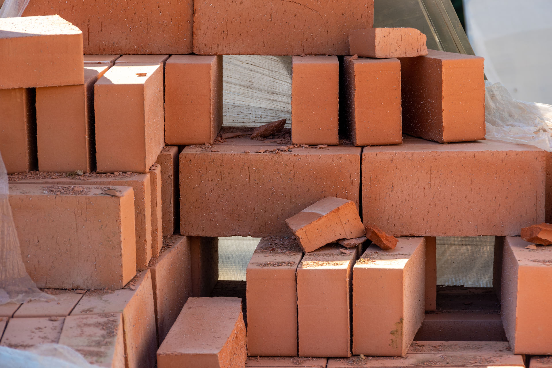 red-bricks-in-a-construction-warehouse-on-the-stre-2024-02-02-00-54-38-utc--1-