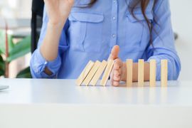 hand-holds-wooden-blocks-the-concept-of-stopping-2023-11-27-04-55-38-utc--1-