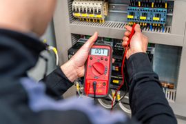 worker-measuring-and-repairing-an-electrical-syste-2024-01-03-01-42-52-utc