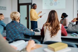 black-senior-man-giving-a-presentation-during-educ-2023-11-27-05-20-02-utc--1-