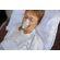 senior-female-patient-in-a-breathing-mask-lies-in-2024-10-18-08-15-12-utc--1-