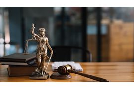 statue-of-lady-justice-on-desk-of-a-judge-or-lawye-2023-11-27-04-56-11-utc--1-