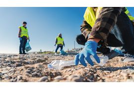 volunteer-man-s-hand-with-gloves-picking-up-plasti-2023-11-27-05-06-12-utc--1-.jpg